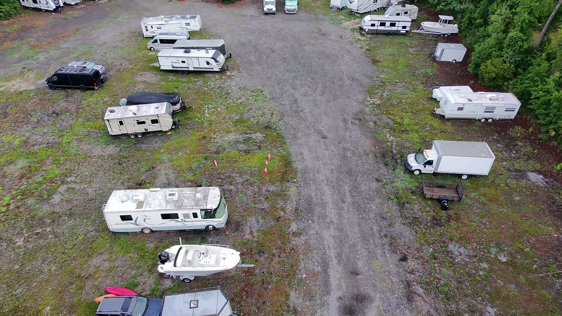 Rows of RVs and trailers parked along the access lane at Duval Truck, RV & Boat Storage in Jacksonville